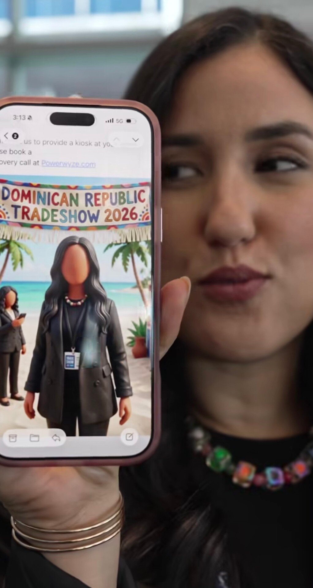 Visitor showing her caricature on her phone