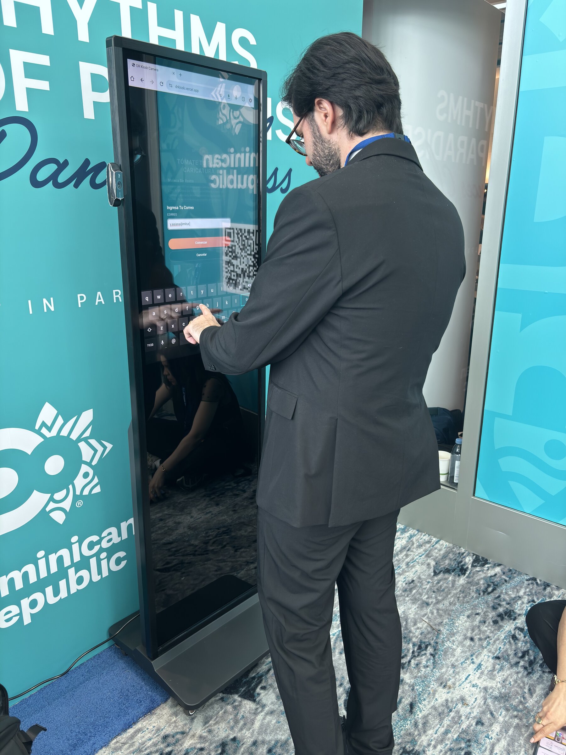 Attendee using the kiosk touchscreen