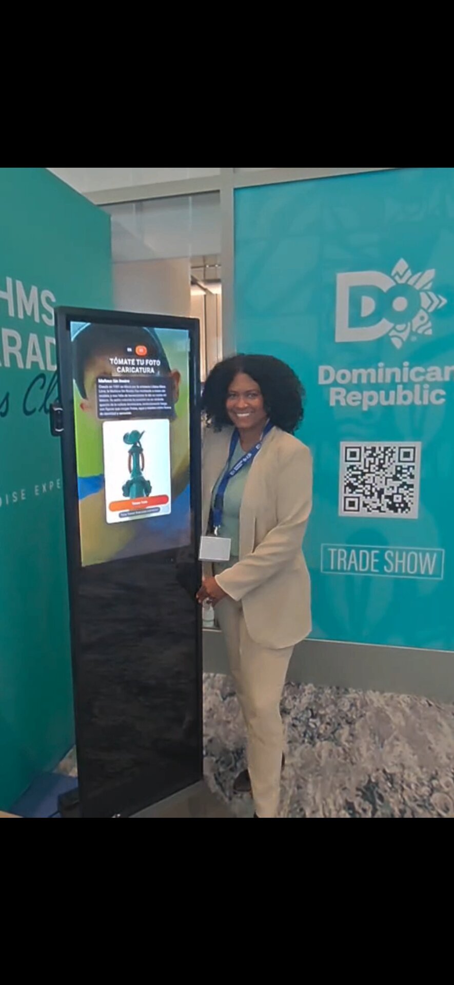 Stephanie next to the kiosk at the DR Trade Show booth