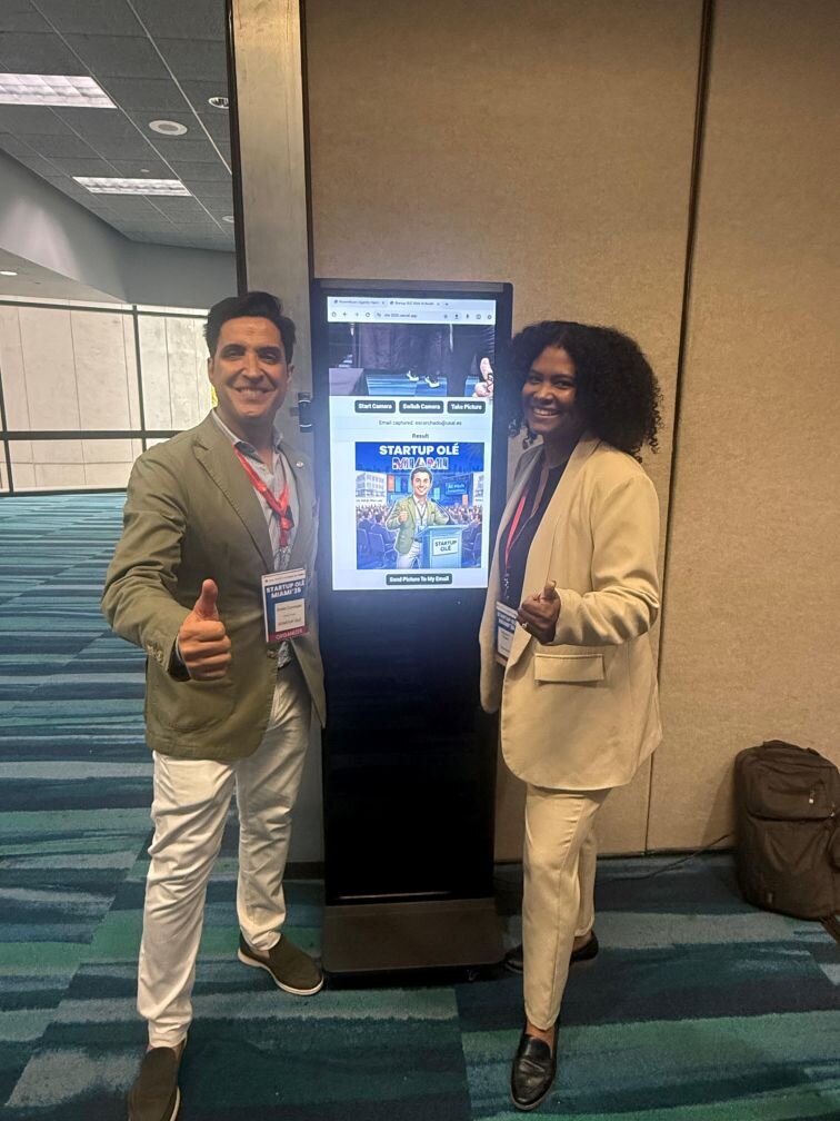 Stephanie and partner with the kiosk at Startup Olé